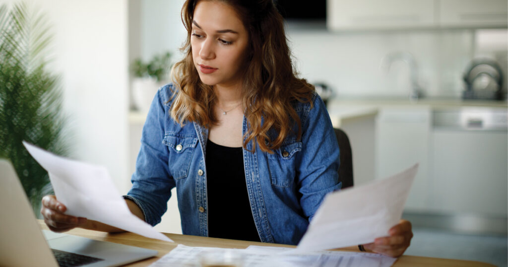 woman looking at paperwork